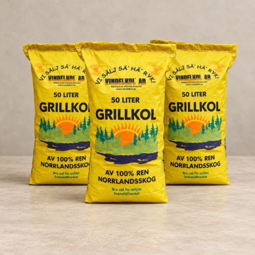 Tre gula säckar Vindelkol Grillkol 50 liter, en i mitten och två bakom